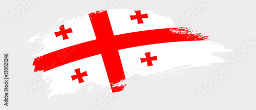 National flag of Georgia with curve stain brush stroke effect on white background