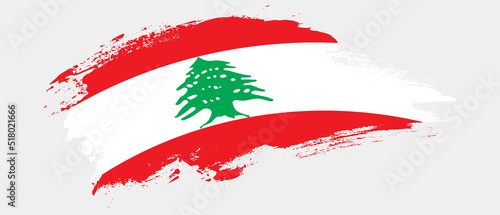 National flag of Lebanon with curve stain brush stroke effect on white background