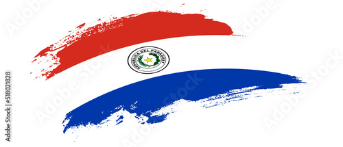 National flag of Paraguay with curve stain brush stroke effect on white background photo