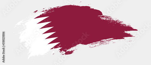 National flag of Qatar with curve stain brush stroke effect on white background