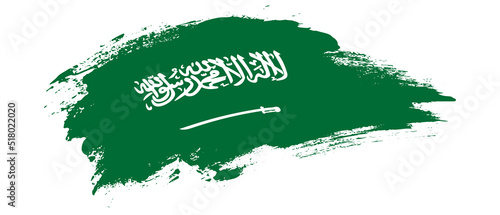 National flag of Saudi Arabia with curve stain brush stroke effect on white background