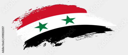 National flag of Syria with curve stain brush stroke effect on white background photo