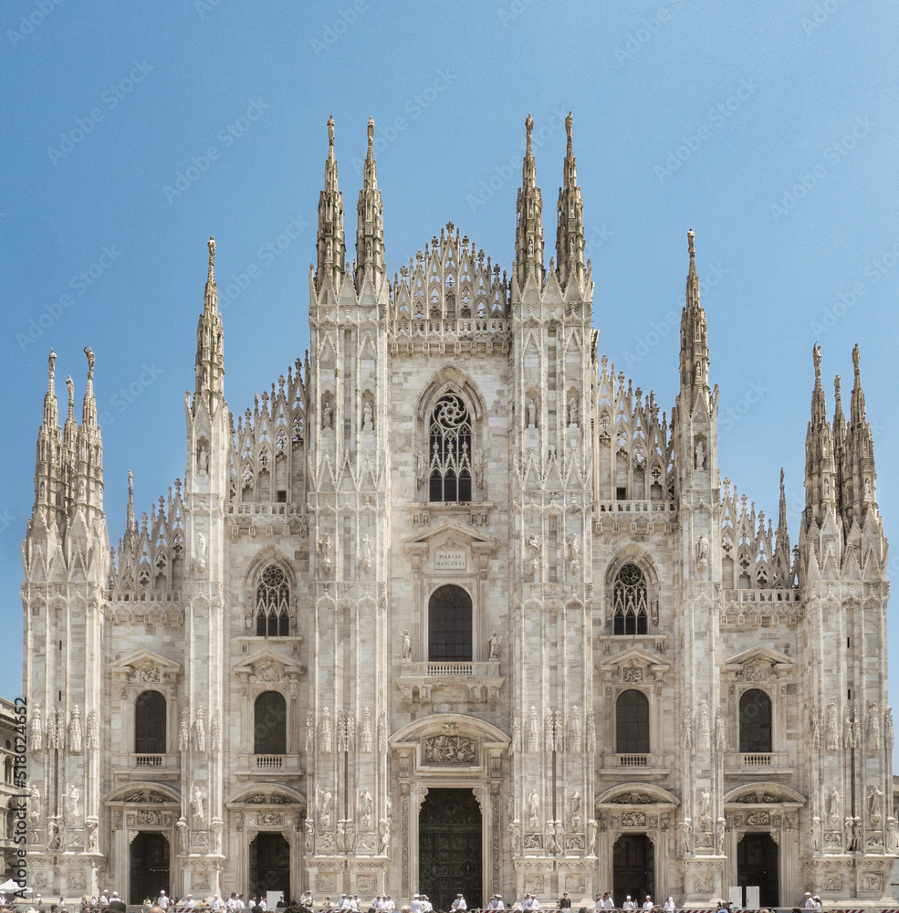 White marble baroque facade decorated with hundreds of statues and bas-reliefs.Milan Cathedral,Italy.