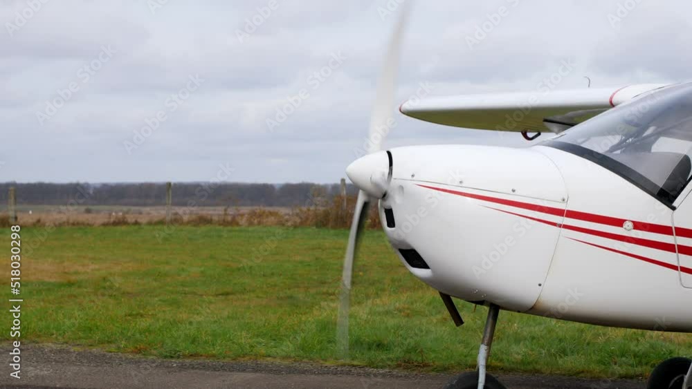 The front of a light singleengine private aircraft with the engine