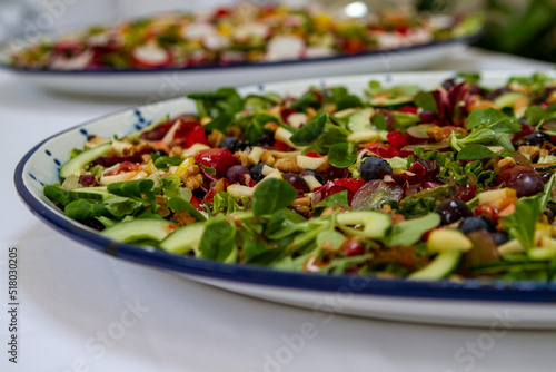Healthy green salad at a buffet table