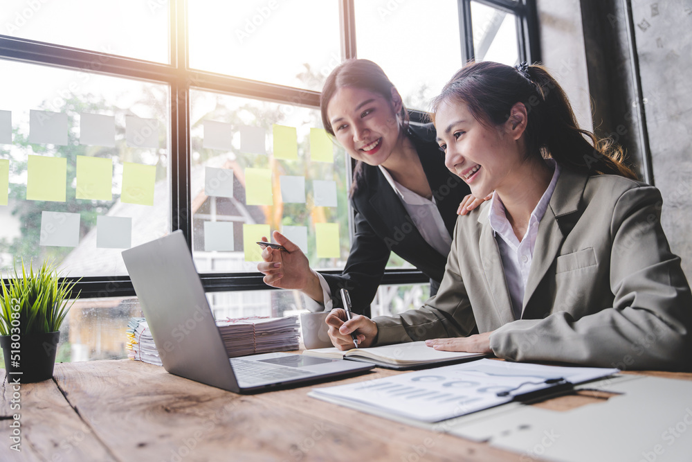 Young colleagues discussing business and price chart analyzes business people on the table great in modern coworking office teamwork concept. Young colleagues discussing business and price chart analyzes business people on the table great in modern coworking office teamwork concept.