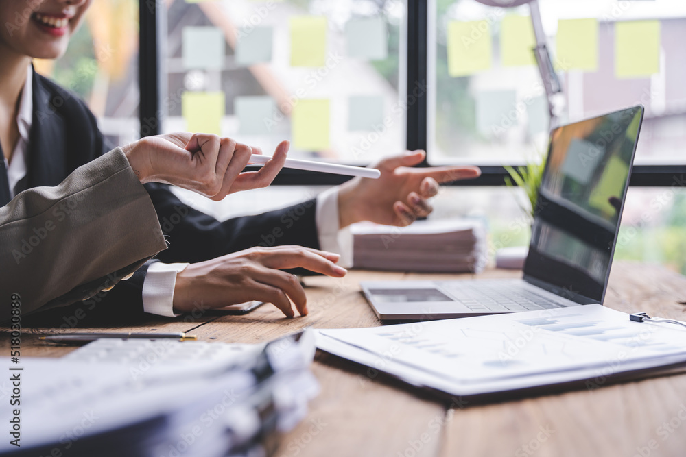 Young colleagues having great business conversations in a modern coworking office. Teamwork concept. Horizontal blurry background. Fireworks. Young colleagues having great business conversations in a modern coworking office. Teamwork concept. Horizontal blurry background. Fireworks.