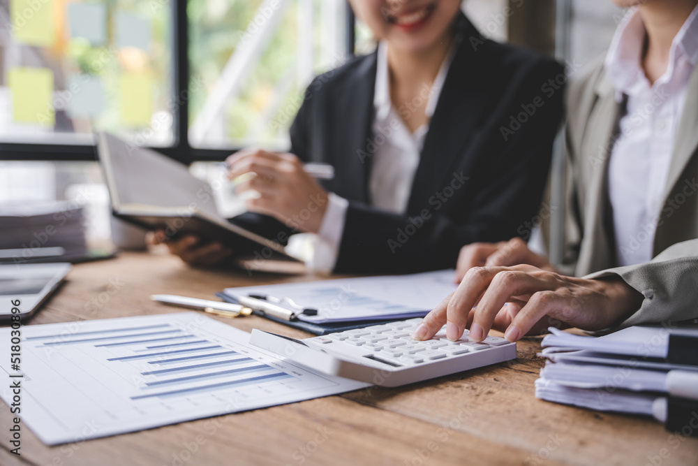 Young colleagues having great business conversations in a modern coworking office. Teamwork concept. Horizontal blurry background. Fireworks. Young colleagues having great business conversations in a modern coworking office. Teamwork concept. Horizontal blurry background. Fireworks.