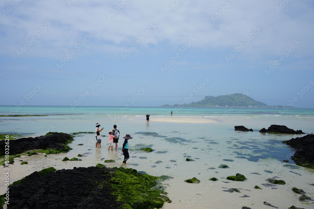 shoaling beach and people and island