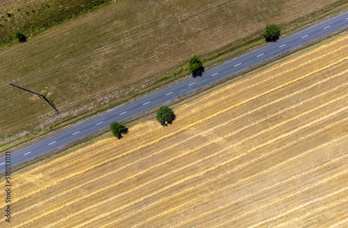 a top view of a road near a stubble