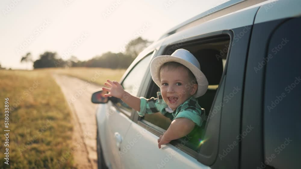 Happy family.Child in car window. Car family trip. Freedom and active holidays. Travel by car in nature. Cheerful smile of children. Kid smile and dream.Happy face in car window.Kids happiness concept Happy family.Child in car window. Car family trip. Freedom and active holidays. Travel by car in nature. Cheerful smile of children. Kid smile and dream.Happy face in car window.Kids happiness concept