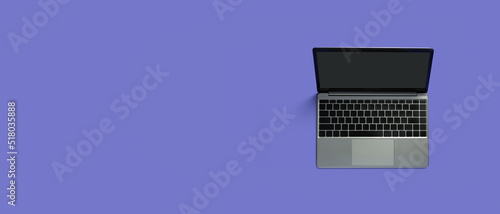 Top view of modern laptop isolated on colored background. Copy space