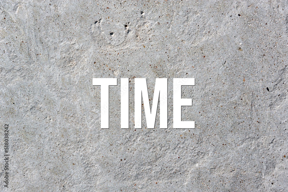 TIME - word on concrete background. Cement floor, wall. TIME - word on concrete background. Cement floor, wall.