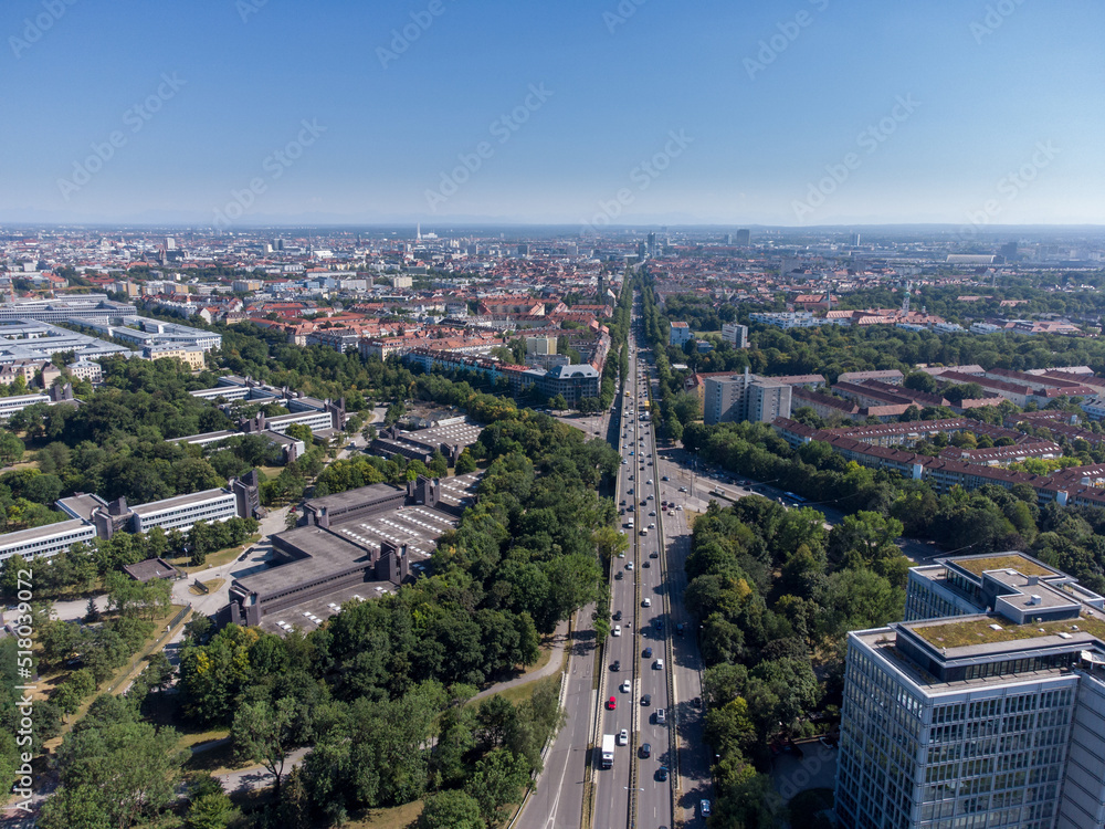 Fototapeta premium Aerial View over Munich to south with the alps in the backround