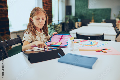 Photos Schoolgirl using tablet