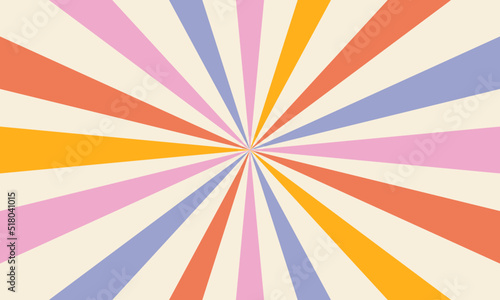 Abstract background of rainbow stripes in the style of 60s 70s. The rays of the sun. Vintage groovy retro background. Hippie aesthetics.