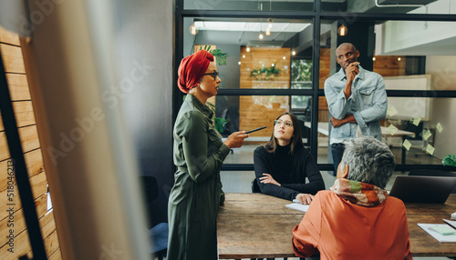 Photos Business manager giving a speech during a meeting