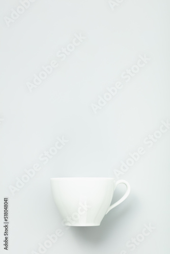 White cup on grey background, flat lay, mock up