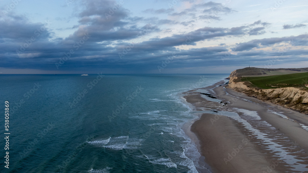 aerial drone shot of the Seascape of the opal coast of Cap Blanc Nez, showing the Monument at Cape white Nose France on top of the chalk cliffs. High quality photo