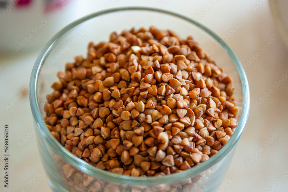 Buckwheat grains in the glass jar. Top view Buckwheat grains in the glass jar. Top view