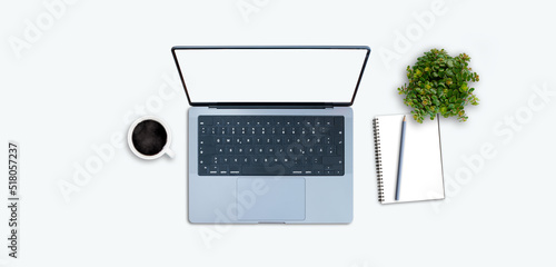 top down view of modern laptop on white table with succulent plant and notepad