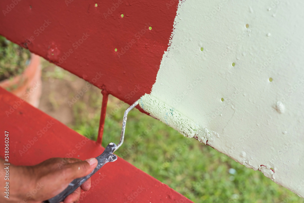 Applying a layer of light green colored quick dry enamel paint on top