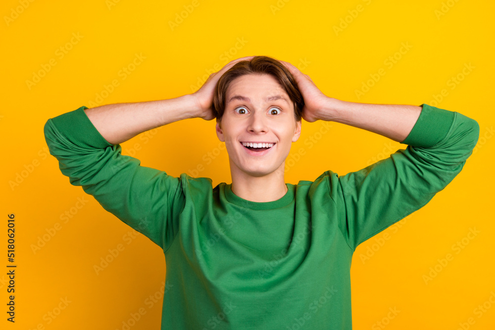 Portrait of crazy excited guy hands head open mouth unexpected novelty isolated bright color background Portrait of crazy excited guy hands head open mouth unexpected novelty isolated bright color background