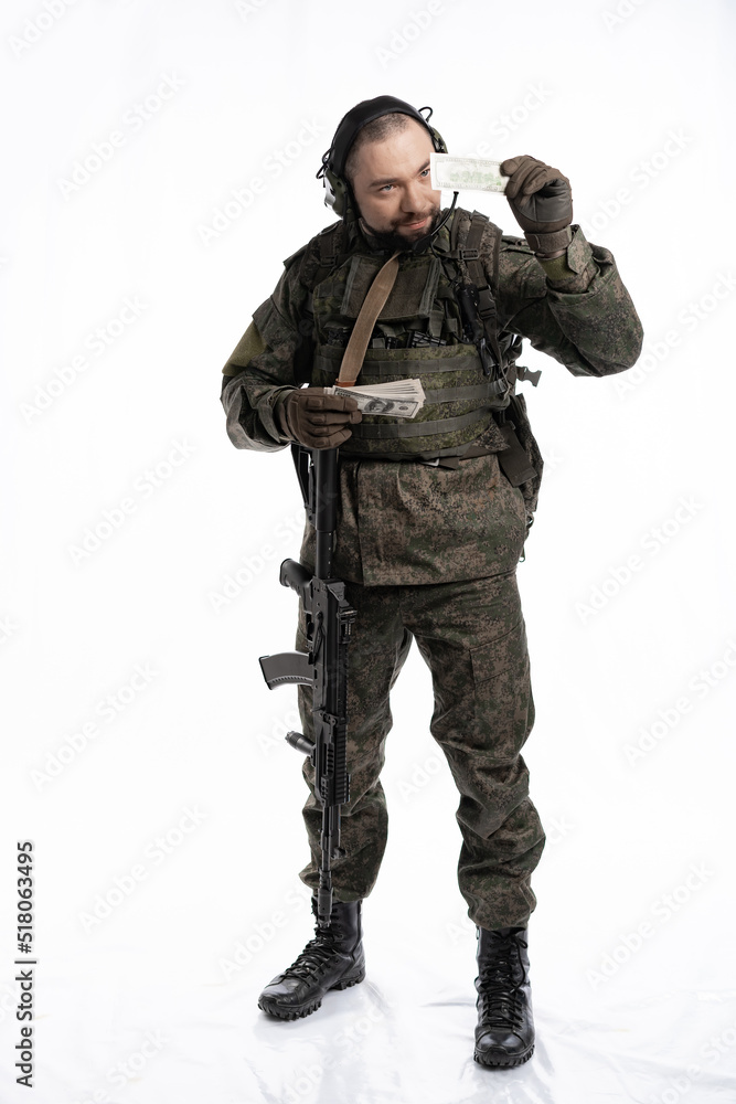 soldier in the studio on a white background. a man in military uniform with a rifle or machine gun. military or airball player soldier in the studio on a white background. a man in military uniform with a rifle or machine gun. military or airball player