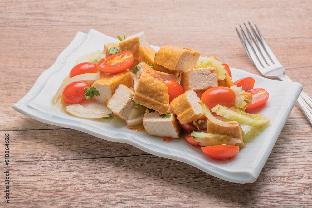 Fried tofu salad with fresh vegetables. Weight loss diet.