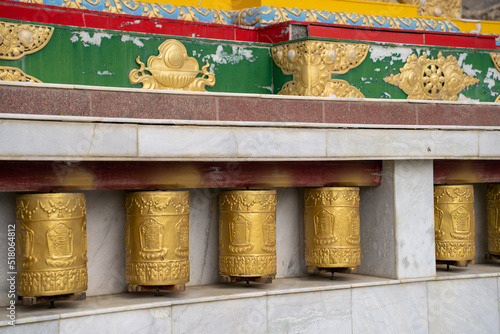 Tibetan metal prayer wheels with mantras at Spiti valley. photo