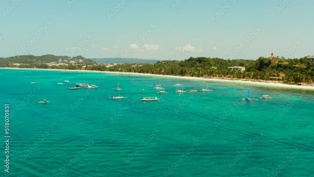 Tropical white sand beach, hotels near the blue lagoon and corall reef. aerial view, Boracay, Philippines. Seascape with beach on tropical island. Summer and travel vacation concept. Tropical white sand beach, hotels near the blue lagoon and corall reef. aerial view, Boracay, Philippines. Seascape with beach on tropical island. Summer and travel vacation concept.