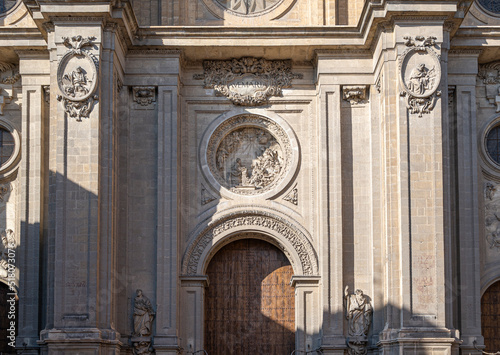 Puerta en la fachada principal de la basílica catedral de Granada siglo XVI de estilo renacimiento y barroco, España photo