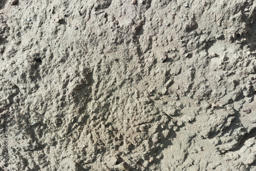 Background texture of pile of sand. Grey colour.