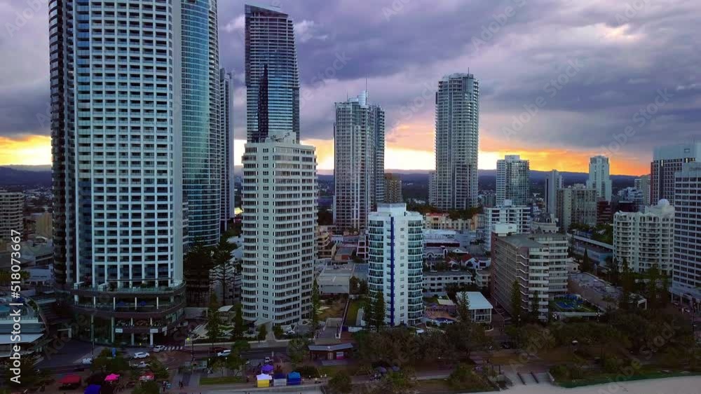 Dramatic View Of High-Rise Buildings Against Clouded Sky At Gold Coast, Queensland, Australia. Aerial Drone Shot Dramatic View Of High-Rise Buildings Against Clouded Sky At Gold Coast, Queensland, Australia. Aerial Drone Shot