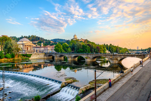 Turin, Italy. Panoramic view at sunset of the Po River, the Church of the Gran Madre, the Church of Monte dei Cappuccini and the Vittorio Emanuel I Bridge. July 13, 2022. photo