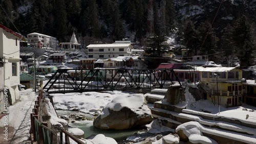 Gangotri town with snow and river photo