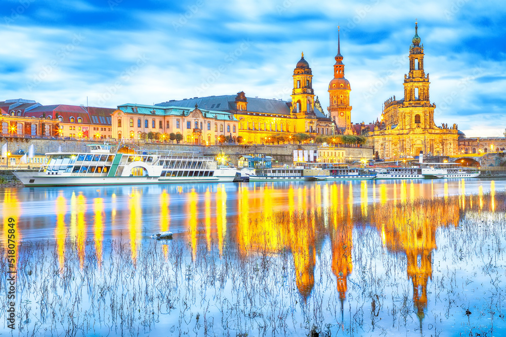 Sunset on Elbe river with panorama of Cathedral of the Holy Trinity or Hofkirche, Bruehl's Terrace or The Balcony of Europe Sunset on Elbe river with panorama of Cathedral of the Holy Trinity or Hofkirche, Bruehl's Terrace or The Balcony of Europe