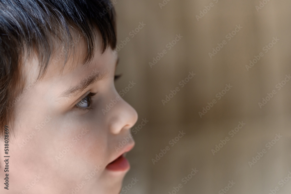 The face of a small child boy close-up The face of a small child boy close-up