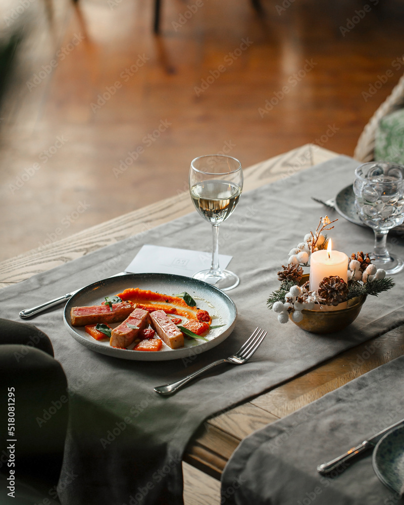 Gourmet restaurant dish with tuna and wine on the table Gourmet restaurant dish with tuna and wine on the table