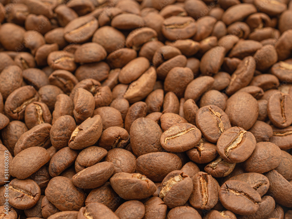 Macro shot of fresh aromatic roasted coffee beans Macro shot of fresh aromatic roasted coffee beans