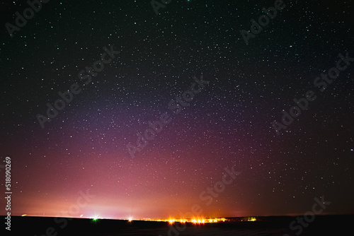 Beautiful Colorful Night Sky Glowing Stars Background Backdrop With Gradient. Sunset Sunrise Lights And Night Starry Sky In Yellow Pink Purple Colors. Copy Space.