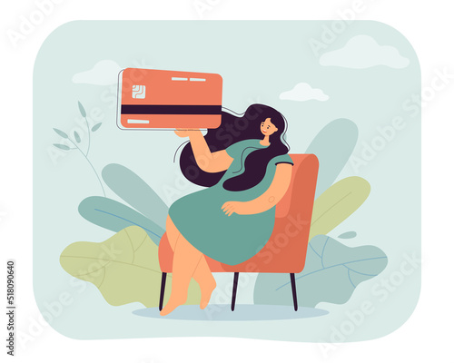 Woman sitting on coach and holding credit card. Person using card for shopping or purchases flat vector illustration. Finance, commerce, banking concept for banner, website design or landing web page