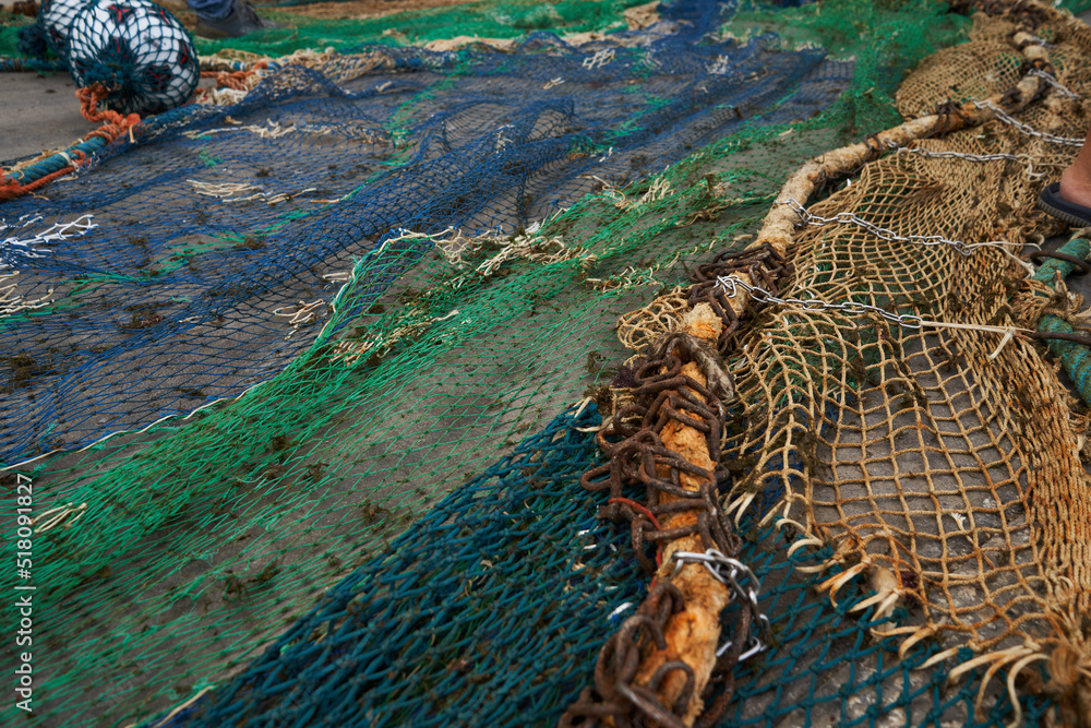 fishing net on the ground ready for fishing Sicily old colored fishing net