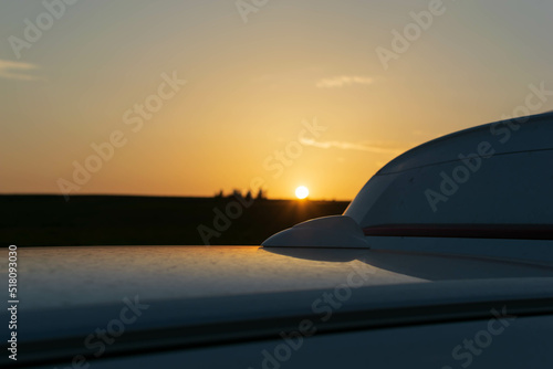 Sunset on the roof of the car