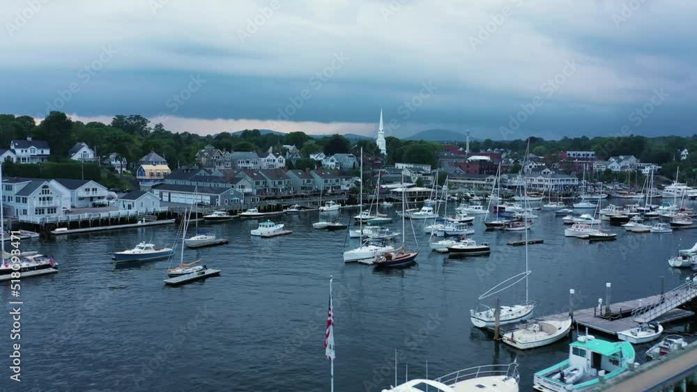 Amazing aerial of coastal scenery of Maine, USA. Buildings on seaside and harbor with boats. Amazing aerial of coastal scenery of Maine, USA. Buildings on seaside and harbor with boats.