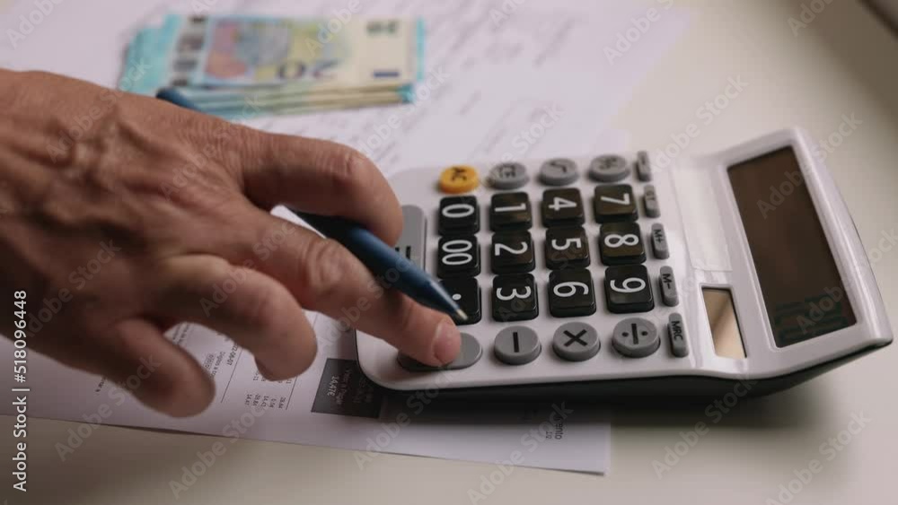 Man counting bills for utilities. Man counting bills for utilities.