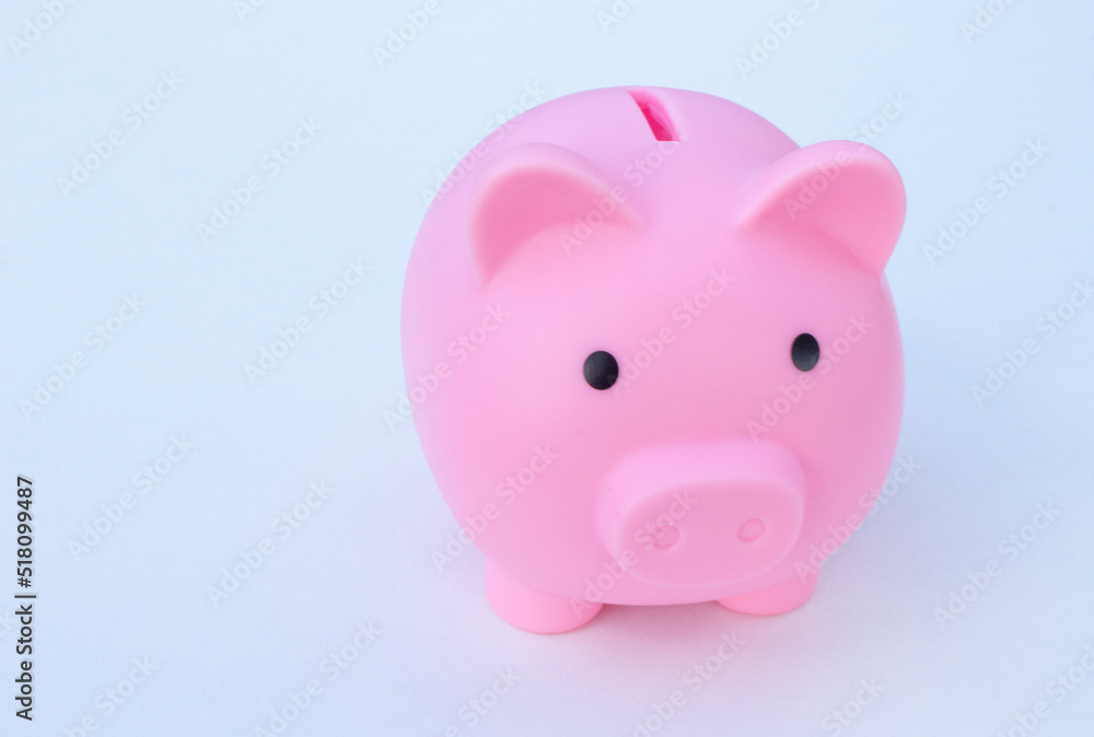Piggy bank on the table. Money saving concept.