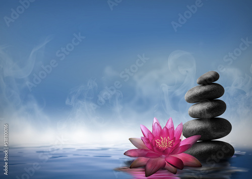 Zen, meditation, harmony. Beautiful lotus flower and stack of stones on water surface, space for text