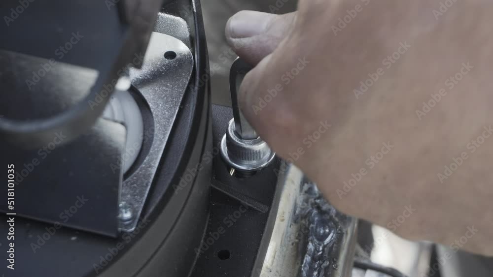 Tightening the bolt with a Hex key. Tightening the bolt with a Hex key.