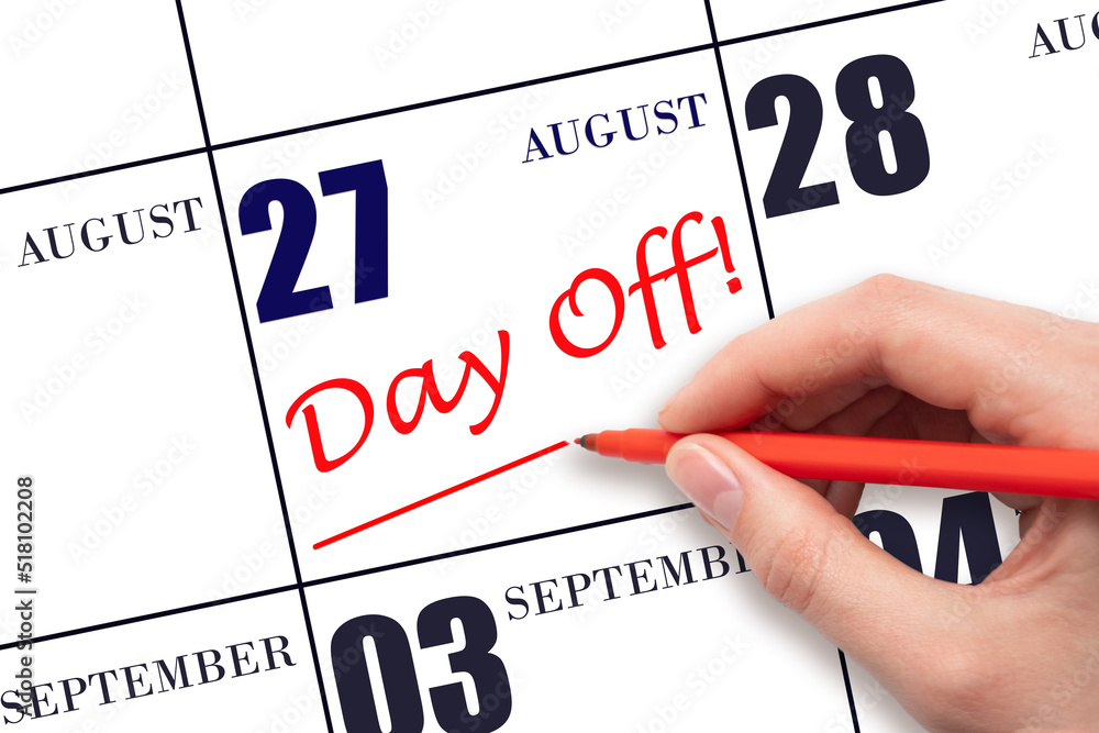 Hand writing text DAY OFF and drawing a line on calendar date 27 August. Vacation planning concept. Hand writing text DAY OFF and drawing a line on calendar date 27 August. Vacation planning concept.